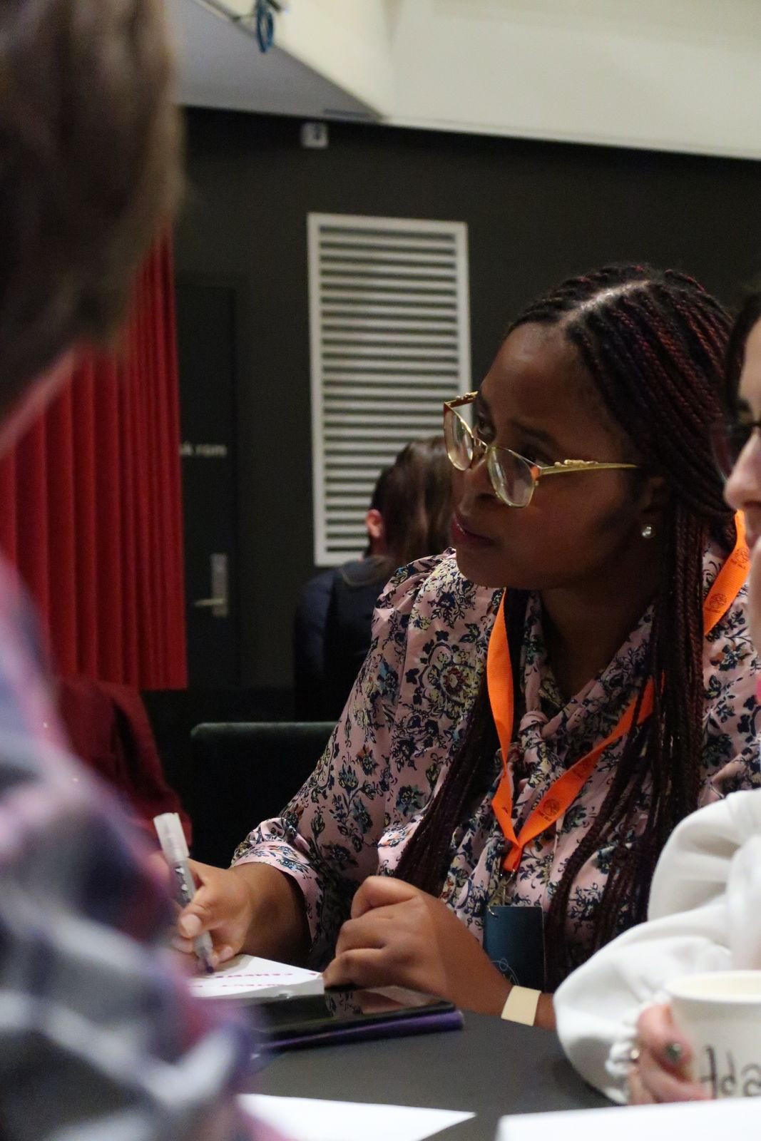 A participant writing notes mid-workshop